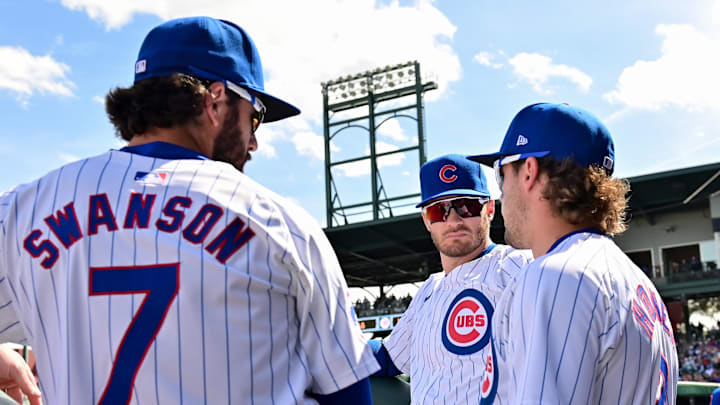 Feb 27, 2024; Mesa, Arizona, USA; Chicago Cubs shortstop Dansby Swanson (7), second baseman Nico Feb 27, 2024; Mesa, Arizona, USA; Chicago Cubs shortstop Dansby Swanson (7), second baseman Nico