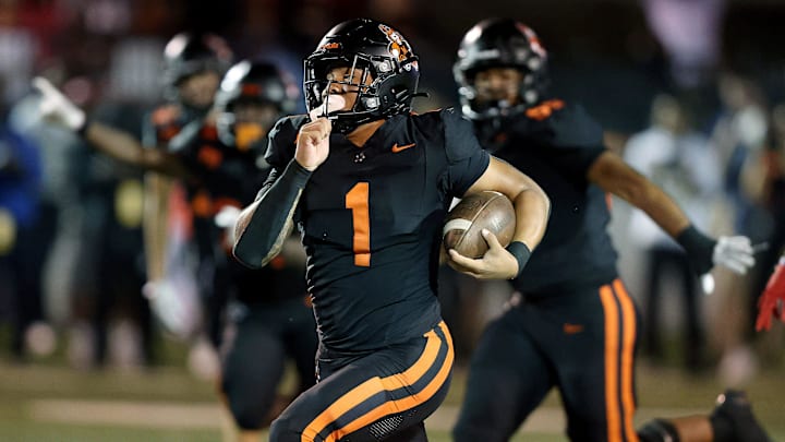 Massillon’s Savior Owens runs for a gain in the second half against Glenville at Paul Brown Tiger Stadium, Friday, Aug. 22, 2025. Massillon’s Savior Owens runs for a gain in the second half against Glenville at Paul Brown Tiger Stadium, Friday, Aug. 22, 2025.