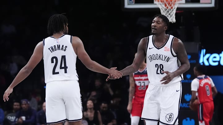 Oct 14, 2024; Brooklyn, New York, USA;Brooklyn Nets small guard Cam Thomas (24) congratulates Brooklyn Nets power forward Dorian Finney-Smith (28) for making a basket against the Washington Wizards during the second half at Barclays Center. Mandatory Credit: Gregory Fisher-Imagn Images Oct 14, 2024; Brooklyn, New York, USA;Brooklyn Nets small guard Cam Thomas (24) congratulates Brooklyn Nets power forward Dorian Finney-Smith (28) for making a basket against the Washington Wizards during the second half at Barclays Center. Mandatory Credit: Gregory Fisher-Imagn Images