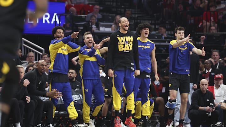 May 4, 2025; Houston, Texas, USA; Golden State Warriors bench players celebrate after a basket by guard Buddy Hield (not pictured) during the second quarter of game seven of the first round for the 2025 NBA Playoffs against the Houston Rockets  at Toyota Center. Mandatory Credit: Troy Taormina-Imagn Images
