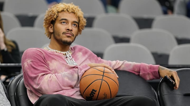Nov 11, 2024; San Antonio, Texas, USA; San Antonio Spurs injured forward Jeremy Sochan (10) watches his team warm up before a game against the Sacramento Kings at Frost Bank Center.