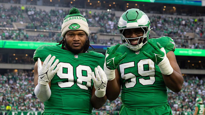 Dec 29, 2024; Philadelphia, Pennsylvania, USA; Philadelphia Eagles defensive tackle Jalen Carter (98) and defensive tackle Thomas Booker IV (59) react on the sideline during the fourth quarter against the Dallas Cowboys at Lincoln Financial Field. Mandatory Credit: Bill Streicher-Imagn Images