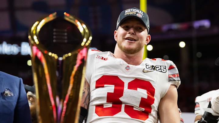 Jan 20, 2025; Atlanta, GA, USA; Ohio State Buckeyes defensive end Jack Sawyer (33) celebrates after defeating the Notre Dame Fighting Irish in the CFP National Championship college football game at Mercedes-Benz Stadium. Mandatory Credit: Mark J. Rebilas-Imagn Images