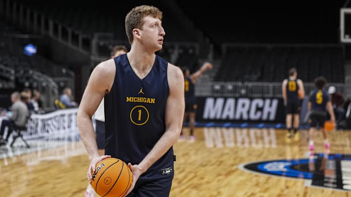 Mar 27, 2025; Atlanta, GA, USA; Michigan Wolverines center Danny Wolf (1) warms up on the court during practice at State Farm Arena. Mar 27, 2025; Atlanta, GA, USA; Michigan Wolverines center Danny Wolf (1) warms up on the court during practice at State Farm Arena.