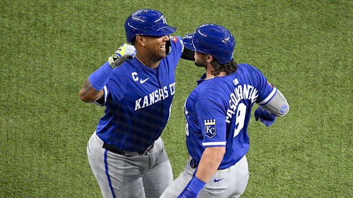 Jun 19, 2025; Arlington, Texas, USA; Kansas City Royals designated hitter Salvador Perez (13) and first baseman Vinnie Pasquantino (9) celebrate after Pasquantino hits a two run home run against the Texas Rangers during the first inning at Globe Life Field. Mandatory Credit: Jerome Miron-Imagn Images