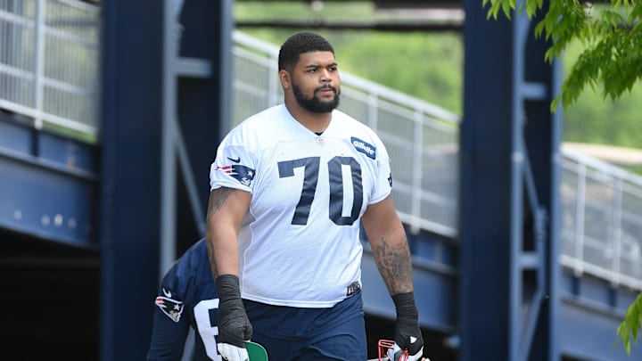 May 23, 2022; Foxborough, MA, USA; New England Patriots offensive tackle Yasir Durant (70) walks to the practice field for the team's OTA at Gillette Stadium. Mandatory Credit: Eric Canha-Imagn Images