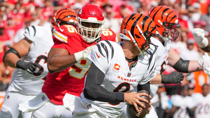 Sep 15, 2024; Kansas City, Missouri, USA; Cincinnati Bengals quarterback Joe Burrow (9) scrambles as Kansas City Chiefs defensive tackle Chris Jones (95) chases during the first half at GEHA Field at Arrowhead Stadium. Mandatory Credit: Denny Medley-Imagn Images Sep 15, 2024; Kansas City, Missouri, USA; Cincinnati Bengals quarterback Joe Burrow (9) scrambles as Kansas City Chiefs defensive tackle Chris Jones (95) chases during the first half at GEHA Field at Arrowhead Stadium. Mandatory Credit: Denny Medley-Imagn Images
