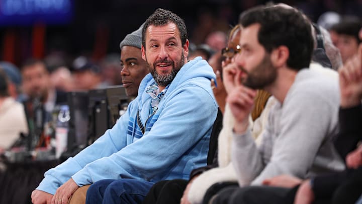 Actor and comedian Adam Sandler looks on during an NBA game between the New York Knicks and the Atlanta Hawks.