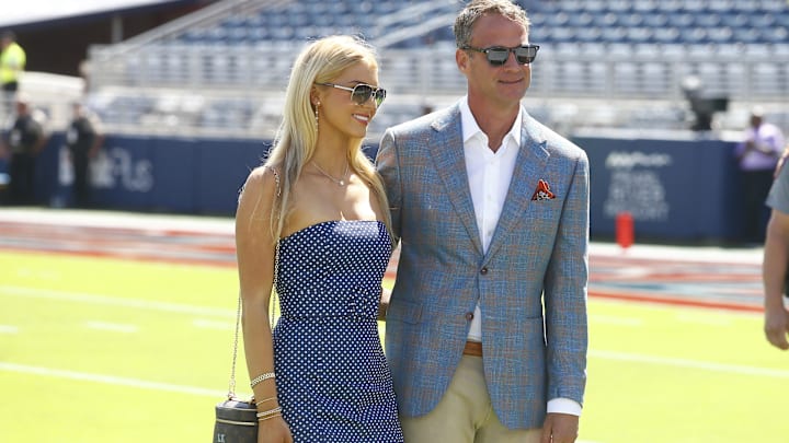 Then Mississippi Rebels head coach Lane Kiffin poses for a photo with his daughter Landry Kiffin prior to the game against the LSU Tigers at Vaught-Hemingway Stadium. 