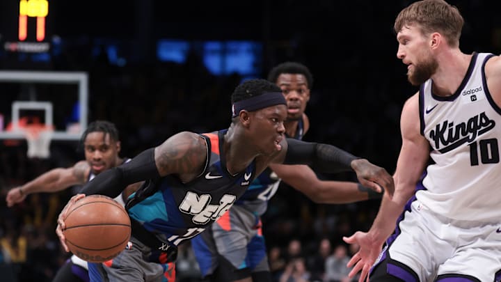 Apr 7, 2024; Brooklyn, New York, USA; Brooklyn Nets guard Dennis Schroder (17) dribbles against Sacramento Kings forward Domantas Sabonis (10) during the second half at Barclays Center. Mandatory Credit: Vincent Carchietta-Imagn Images