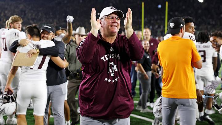 Texas A&M Aggies head coach Mike Elko celebrates after the game against the Notre Dame Fighting Irish at Notre Dame Stadium. Texas A&M Aggies head coach Mike Elko celebrates after the game against the Notre Dame Fighting Irish at Notre Dame Stadium.