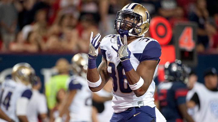 Azeem Victor (36) celebrates the UW's 35-28 overtime victory over Arizona in 2016. Azeem Victor (36) celebrates the UW's 35-28 overtime victory over Arizona in 2016.