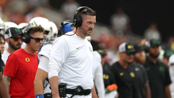 Sep 26, 2026; Los Angeles, California, USA;  Oregon Ducks head coach Dan Lanning  watches game play against the USC Trojans during the first quarter at United Airlines Field at Los Angeles Memorial Coliseum.  Mandatory Credit: Kiyoshi Mio-Imagn Images