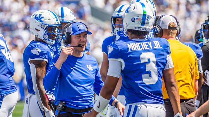 Sep 5, 2026; Lexington, Kentucky, USA; Kentucky Wildcats head coach Will Stein talks to Kentucky Wildcats quarterback Kenny Minchey (3) during a time out during the first quarter against the Youngstown State Penguins at Kroger Field. Mandatory Credit: Arden Barnes-Imagn Images Sep 5, 2026; Lexington, Kentucky, USA; Kentucky Wildcats head coach Will Stein talks to Kentucky Wildcats quarterback Kenny Minchey (3) during a time out during the first quarter against the Youngstown State Penguins at Kroger Field. Mandatory Credit: Arden Barnes-Imagn Images