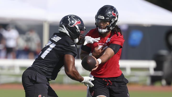 Jul 24, 2025; Houston, TX, USA; Houston Texans quarterback C.J. Stroud (7) and running back Nick Chubb (21) during training camp at Houston Methodist Training Center. Mandatory Credit: Troy Taormina-Imagn Images