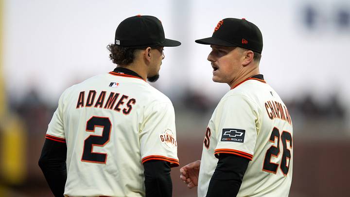 San Francisco, California, USA; San Francisco Giants shortstop Willy Adames (2) and third baseman Matt Chapman (26) confer during the sixth inning against the San Diego Padres at Oracle Park. Mandatory Credit: D. Ross Cameron-Imagn Images
