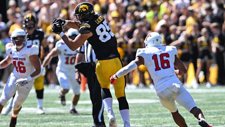 Aug 31, 2024; Iowa City, Iowa, USA; Iowa Hawkeyes tight end Luke Lachey (85) catches a pass as Illinois State Redbirds quarterback Tommy Rittenhouse (16) pursues during the second quarter at Kinnick Stadium. Mandatory Credit: Jeffrey Becker-Imagn Images