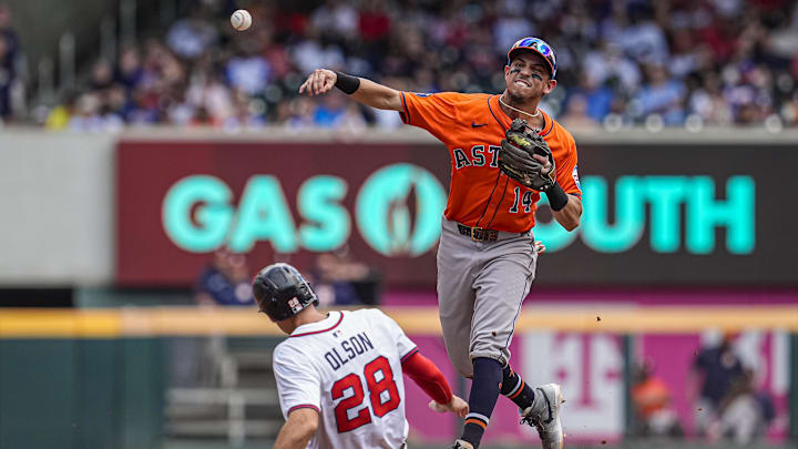 Sep 14, 2025; Cumberland, Georgia, USA; Houston Astros second baseman Mauricio Dubon (14) tries to complete a double play over Atlanta Braves first baseman Matt Olson (28) during the third inning at Truist Park. Sep 14, 2025; Cumberland, Georgia, USA; Houston Astros second baseman Mauricio Dubon (14) tries to complete a double play over Atlanta Braves first baseman Matt Olson (28) during the third inning at Truist Park.