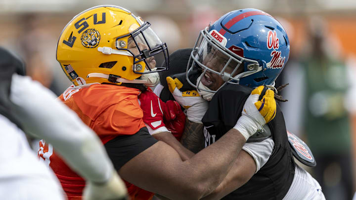Jan 28, 2025; Mobile, AL, USA; American team offensive lineman Miles Frazier of LSU (70) spars with American team defensive lineman Walter Nolen of Ole Miss (2) during Senior Bowl practice for the American team at Hancock Whitney Stadium. Mandatory Credit: Vasha Hunt-Imagn Images Jan 28, 2025; Mobile, AL, USA; American team offensive lineman Miles Frazier of LSU (70) spars with American team defensive lineman Walter Nolen of Ole Miss (2) during Senior Bowl practice for the American team at Hancock Whitney Stadium. Mandatory Credit: Vasha Hunt-Imagn Images