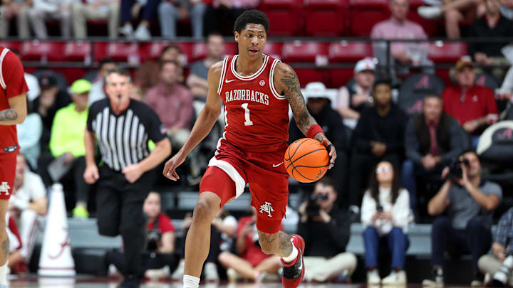 Feb 18, 2026; Tuscaloosa, Alabama, USA; Arkansas Razorback guard Meleek Thomas (1) dribbles a fast break during the first half against the Alabama Crimson Tide at Coleman Coliseum. Mandatory Credit: David Leong-Imagn Images