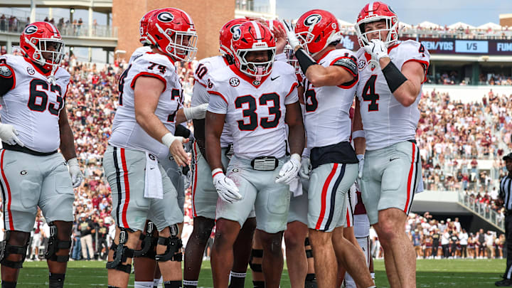 Nov 8, 2025; Starkville, Mississippi, USA; Georgia Bulldogs running back Chauncey Bowens (33) reacts after a touchdown against the Mississippi State Bulldogs during the first half at Davis Wade Stadium at Scott Field. Mandatory Credit: Wesley Hale-Imagn Images