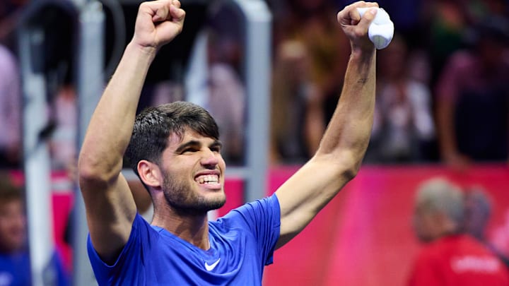 Carlos Alcaraz of Team Europe celebrates with teammates after winning match and championship point against Taylor Fritz of Team World during the Laver Cup.