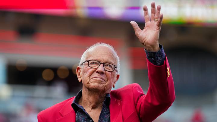 Apr 25, 2026; Cincinnati, Ohio, USA;  Reds Hall of Famer and former broadcaster Marty Brennaman, acknowledges the crowd during a Reds Hall of Fame induction ceremony before the game between the Detroit Tigers and the Cincinnati Reds at Great American Ball Park. Mandatory Credit: Aaron Doster-Imagn Images