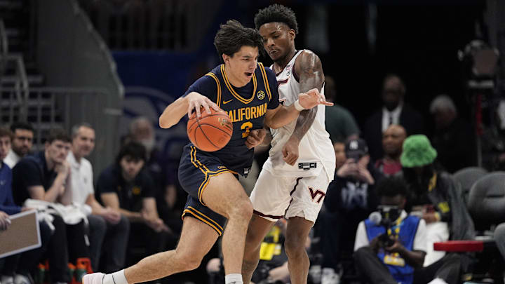 Mar 11, 2025; Charlotte, NC, USA; California Golden Bears guard Andrej Stojakovic (2) drives to the basket against Virginia Tech Hokies guard Jaydon Young (3) during OT at Spectrum Center. Mandatory Credit: Jim Dedmon-Imagn Images