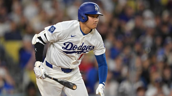 Apr 10, 2026; Los Angeles, California, USA; Los Angeles Dodgers two-way player Shohei Ohtani (17) singles in the fifth inning against the Texas Rangers at Dodger Stadium. Mandatory Credit: Jayne Kamin-Oncea-Imagn Images