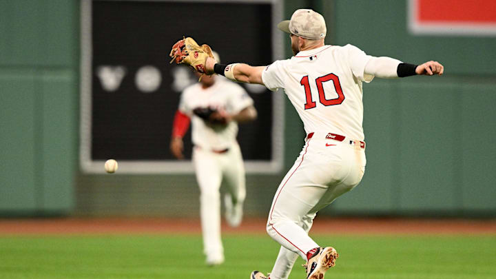 May 17, 2025; Boston, Massachusetts, USA; Boston Red Sox shortstop Trevor Story (10) misses a catch  during the fourth inning against the Atlanta Braves at Fenway Park. Mandatory Credit: Brian Fluharty-Imagn Images