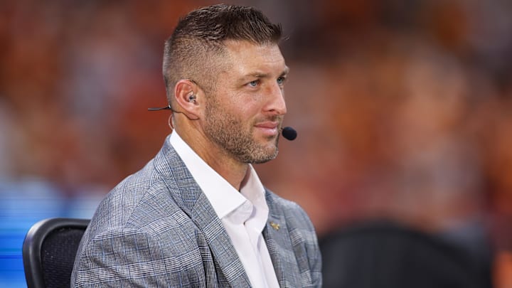 Aug 30, 2025; Atlanta, Georgia, USA; SEC Network analyst Tim Tebow on the field before a game between the Tennessee Volunteers and Syracuse Orange at Mercedes-Benz Stadium. Mandatory Credit: Brett Davis-Imagn Images
