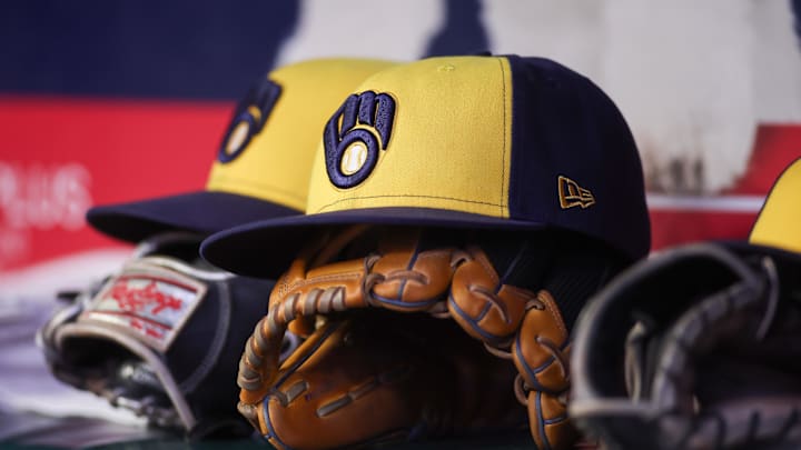 Aug 4, 2025; Atlanta, Georgia, USA; A detailed view of a Milwaukee Brewers hat and glove in the dugout against the Atlanta Braves in the fourth inning at Truist Park. Mandatory Credit: Brett Davis-Imagn Images Aug 4, 2025; Atlanta, Georgia, USA; A detailed view of a Milwaukee Brewers hat and glove in the dugout against the Atlanta Braves in the fourth inning at Truist Park. Mandatory Credit: Brett Davis-Imagn Images