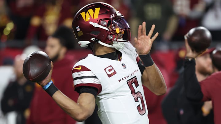 Jan 12, 2025; Tampa, Florida, USA; Washington Commanders quarterback Jayden Daniels (5) warms up before a NFC wild card playoff against the Tampa Bay Buccaneers at Raymond James Stadium. Mandatory Credit: Kim Klement Neitzel-Imagn Images