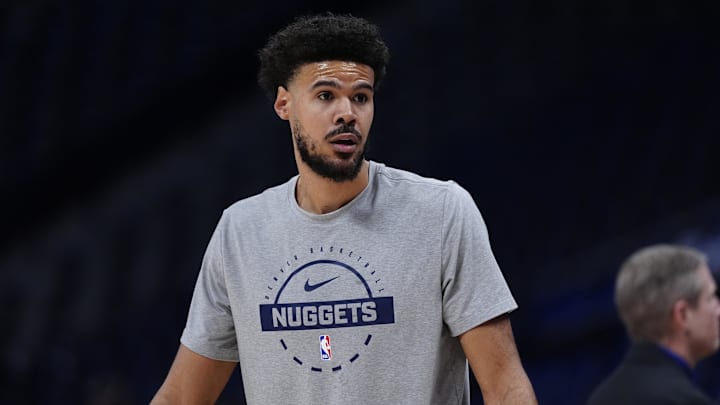 Dec 18, 2025; Denver, Colorado, USA;  Denver Nuggets forward Cameron Johnson (23) warms up before the game against the Orlando Magic at Ball Arena. Mandatory Credit: Ron Chenoy-Imagn Images