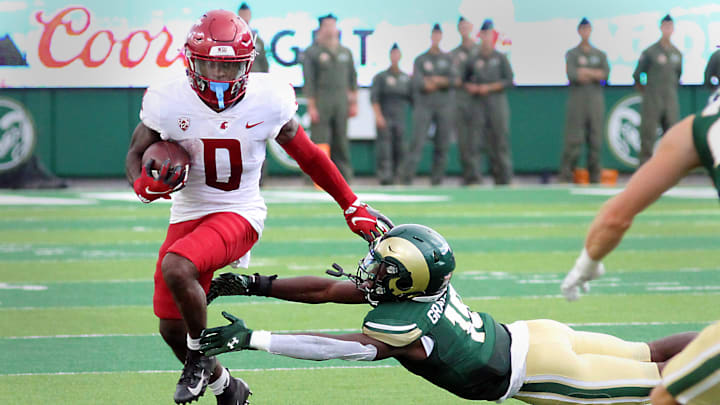 Colorado State's Tyrell Grayson Jr. works to make a diving tackle on Washington State wide receiver DT Sheffield during the first half of the Rams first game of the season on Saturday, Sept. 2, 2023. The Rams were defeated 50-24.