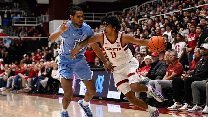 Jan 14, 2026; Stanford, California, USA; Stanford Cardinal guard Ryan Agarwal (11) dribbles against North Carolina Tar Heels forward Jarin Stevenson (15) in the first half at Maples Pavilion. Mandatory Credit: Eakin Howard-Imagn Images