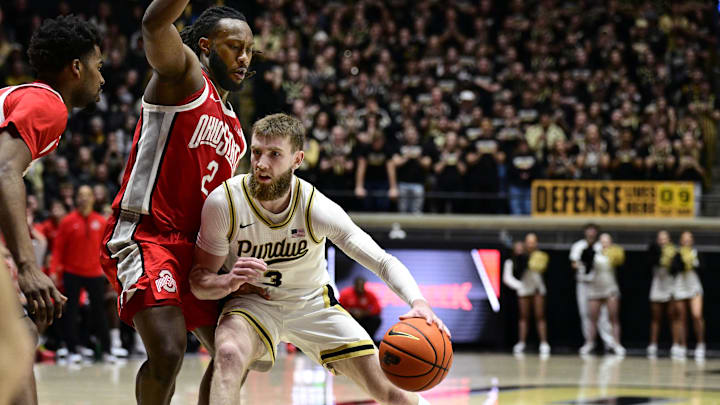 Jan 21, 2025; West Lafayette, Indiana, USA; Purdue Boilermakers guard Braden Smith (3) Leans into Ohio State Buckeyes guard Bruce Thornton (2) during the second half at Mackey Arena. Mandatory Credit: Marc Lebryk-Imagn Images