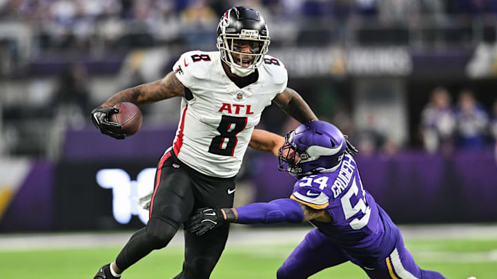 Dec 8, 2024; Minneapolis, Minnesota, USA; Atlanta Falcons tight end Kyle Pitts (8) gets yards after the catch as Minnesota Vikings linebacker Kamu Grugier-Hill (54) attempts to make the tackle during the fourth quarter at U.S. Bank Stadium. Mandatory Credit: Jeffrey Becker-Imagn Images
