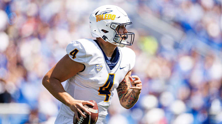 Aug 30, 2025; Lexington, Kentucky, USA; Toledo Rockets quarterback Tucker Gleason (4) looks to pass during the first quarter against the Kentucky Wildcats at Kroger Field. Mandatory Credit: Jordan Prather-Imagn Images