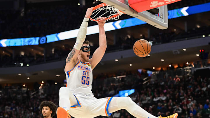 Mar 16, 2025; Milwaukee, Wisconsin, USA;  Oklahoma City Thunder center Isaiah Hartenstein (55) dunks the ball in the second quarter against the Milwaukee Bucks at Fiserv Forum. Mandatory Credit: Benny Sieu-Imagn Images
