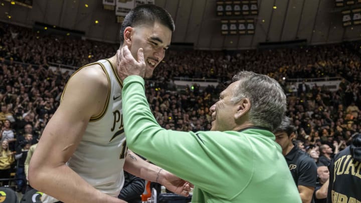 Purdue center Zach Edey shares a moment after the game with Michigan State coach Tom Izzo 