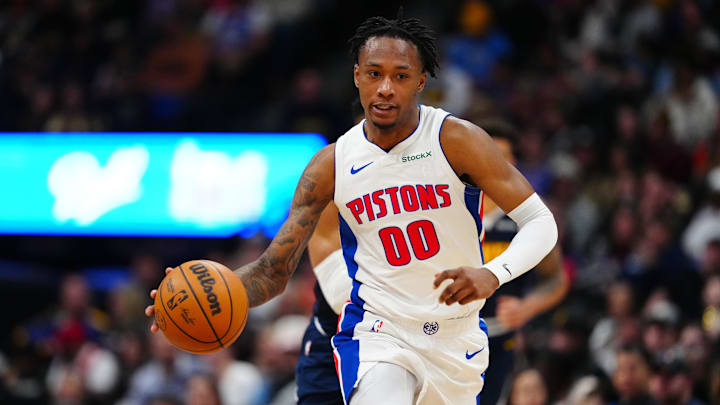Dec 28, 2024; Denver, Colorado, USA; Detroit Pistons forward Ronald Holland II (00) dribbles up court in the second half against the Denver Nuggets at Ball Arena. Mandatory Credit: Ron Chenoy-Imagn Images