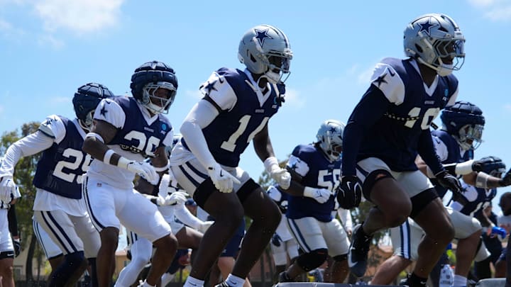 Dallas Cowboys defensive players run drills at training camp at the River Ridge Fields. 