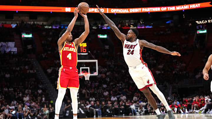 Oct 16, 2024; Miami, Florida, USA; Atlanta Hawks guard Kobe Bufkin (4) shoots the ball as Miami Heat forward Haywood Highsmith (24) defends in the second half at Kaseya Center. Mandatory Credit: Jim Rassol-Imagn Images Oct 16, 2024; Miami, Florida, USA; Atlanta Hawks guard Kobe Bufkin (4) shoots the ball as Miami Heat forward Haywood Highsmith (24) defends in the second half at Kaseya Center. Mandatory Credit: Jim Rassol-Imagn Images