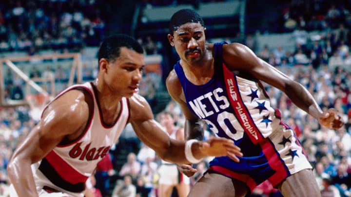Nov 19, 1985; Portland, OR, USA: FILE PHOTO; New Jersey Nets guard Michael Ray Richardson (20) battles for a loose ball against Portland Trailblazers guard Darnell Valentine (left)  at Memorial Coliseum. Mandatory Credit: Imagn Images