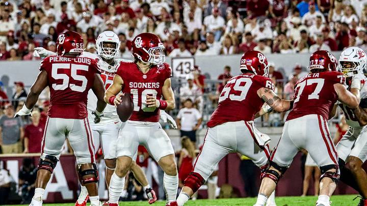 Oklahoma quarterback John Mateer takes a snap against New Mexico as Eddy Pierre-Louis, Jake Maikkula and Heath Ozaeta block. Oklahoma quarterback John Mateer takes a snap against New Mexico as Eddy Pierre-Louis, Jake Maikkula and Heath Ozaeta block.