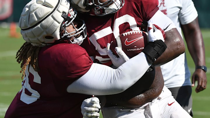 The Crimson Tide players and coaches continue working toward the season opener in practice Tuesday, Aug. 13, 2024. Alabama defensive lineman Tim Keenan III (96) and Alabama defensive lineman Tim Smith (50) work on a drill.