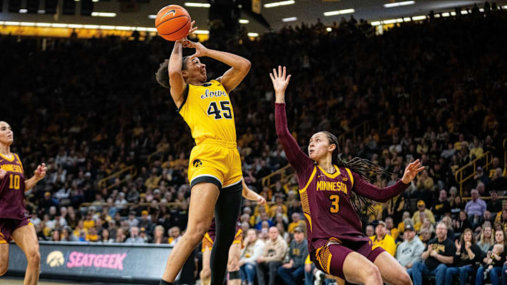 Iowa forward Hannah Stuelke (45) looks to shoot against Minnesota guard Amaya Battle (3) on Feb. 5, 2026, at Carver-Hawkeye Arena