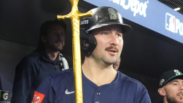 Seattle Mariners catcher Cal Raleigh (29) celebrates in the dugout after scoring against the Toronto Blue Jays in the fifth inning during game seven of the ALCS round for the 2025 MLB playoffs at Rogers Centre. 