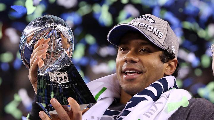 Seattle Seahawks quarterback Russell Wilson celebrates with the Vince Lombardi Trophy